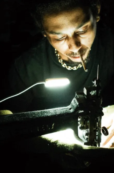 Late-night stitching by lamp light