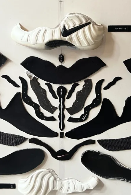 Deconstructed sneaker parts laid out